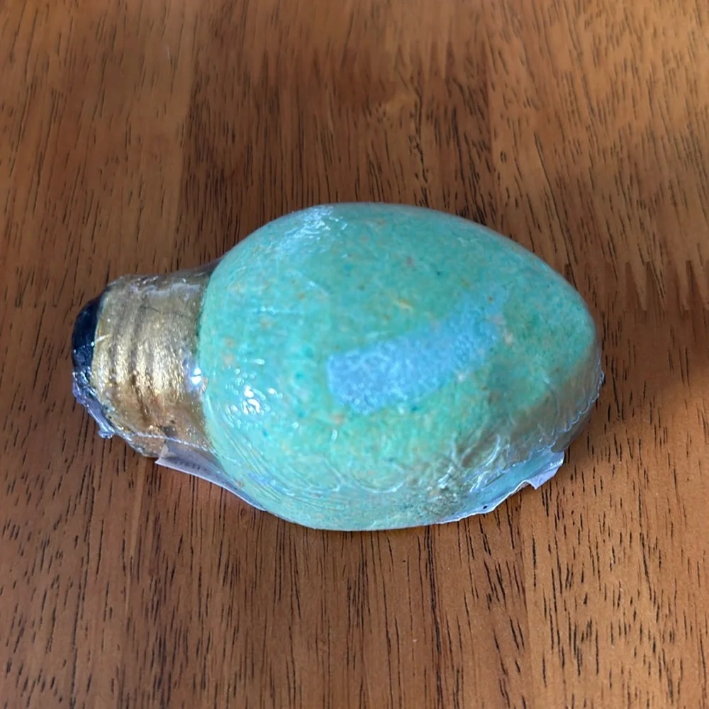 Bath bomb. Christmas bulb design with Christmas cookie smell. Lights up